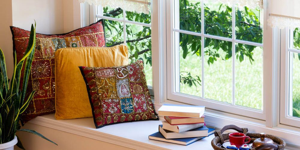 window-seat-with-sash-windows-books-and-cushions window-seat-with-sash-windows-books-and-cushions