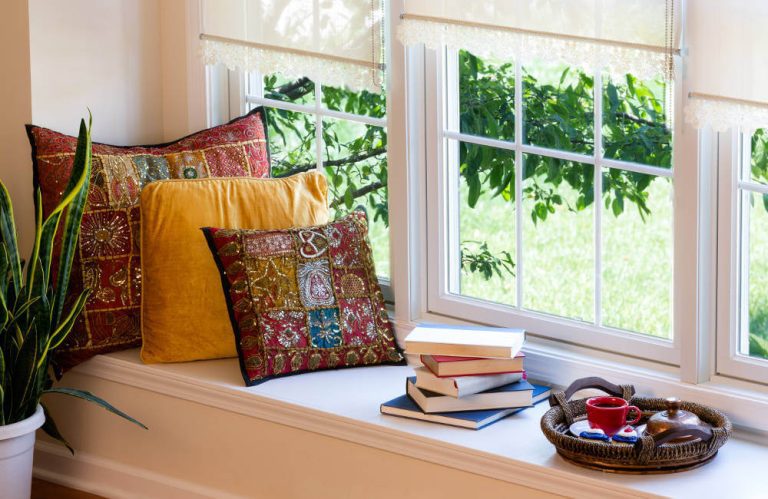 window-seat-with-sash-windows-books-and-cushions