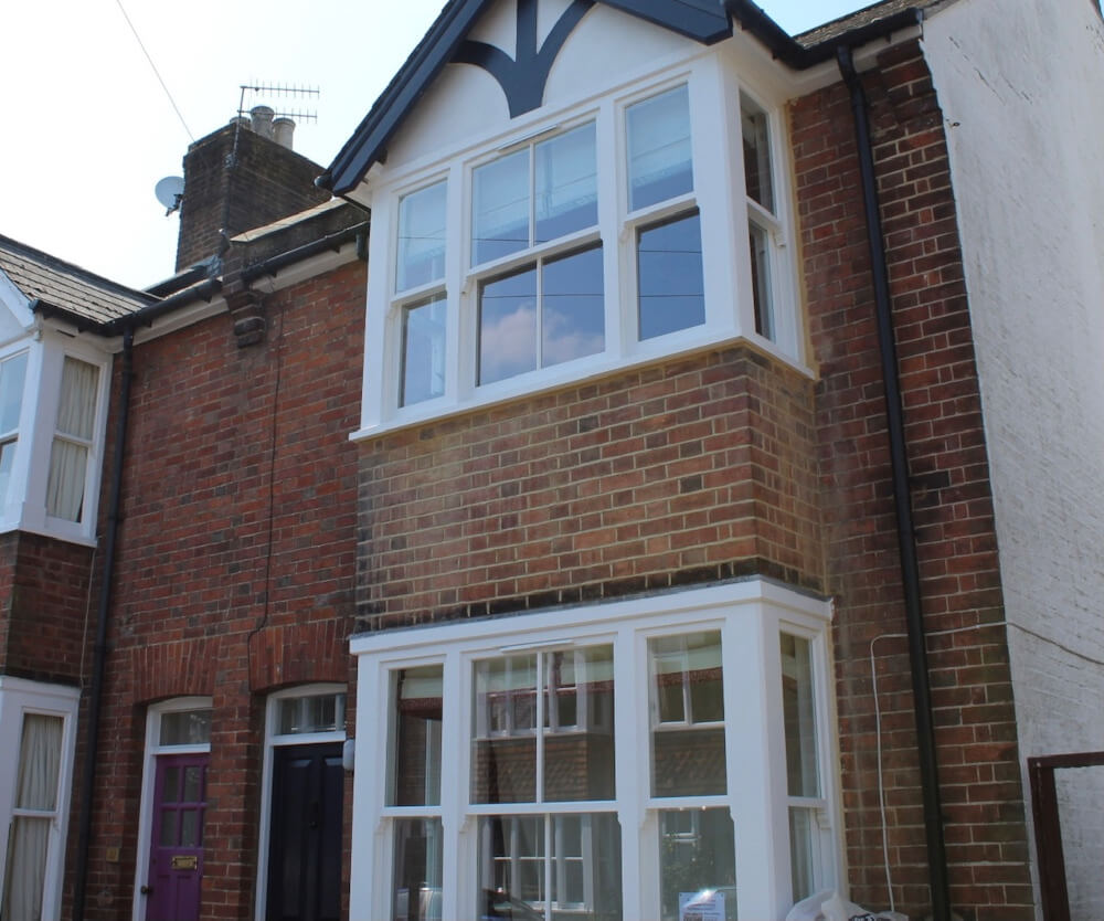 At this property the client wanted us to completely transform the front façade. The existing windows in place were UPVC plastic casement windows with small top openers.