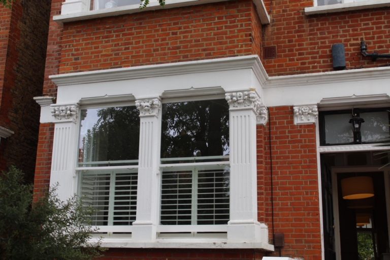 External view of replacement windows with vacuum insulated glass