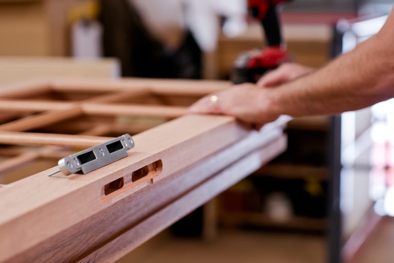 Timber front door being made in a workshop in London