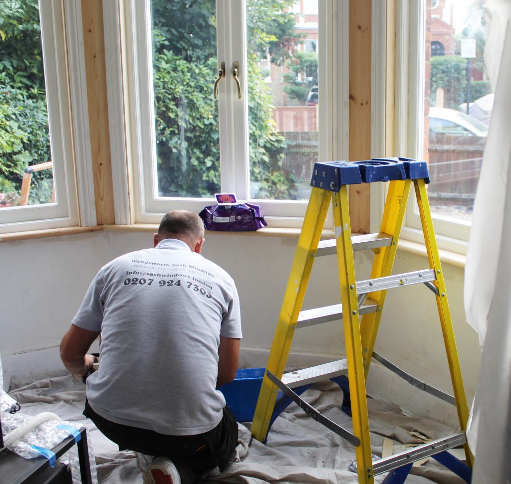 Wandsworth Sash Windows installer fitting architraves to timber casement windows