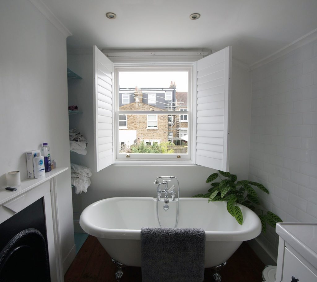 Bathroom sash windows with open shutters