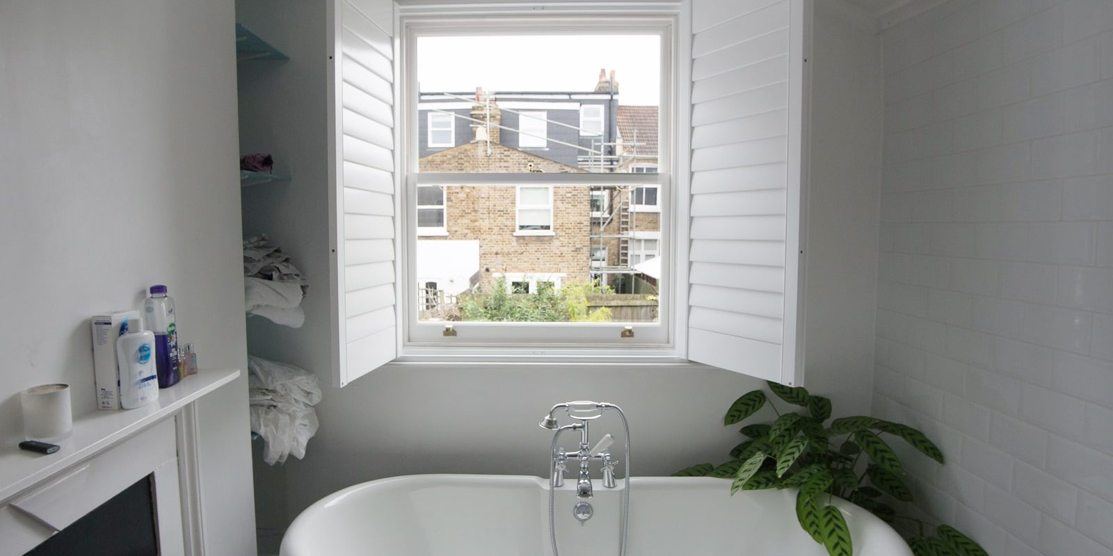 Bathroom sash windows with open shutters