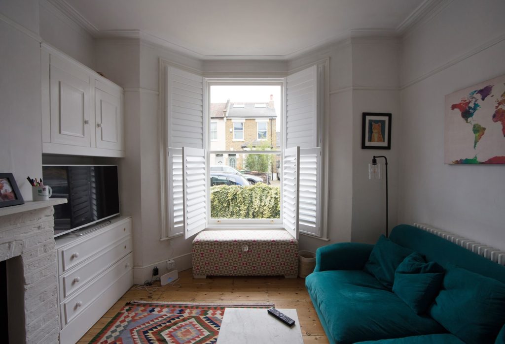 Lounge sash windows with open shutters