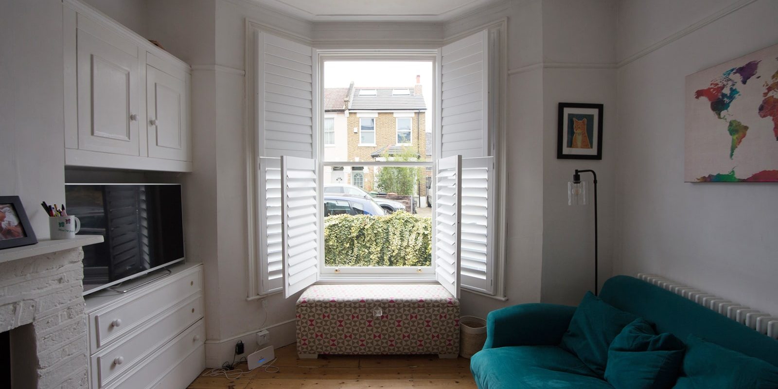 Lounge sash windows with open shutters