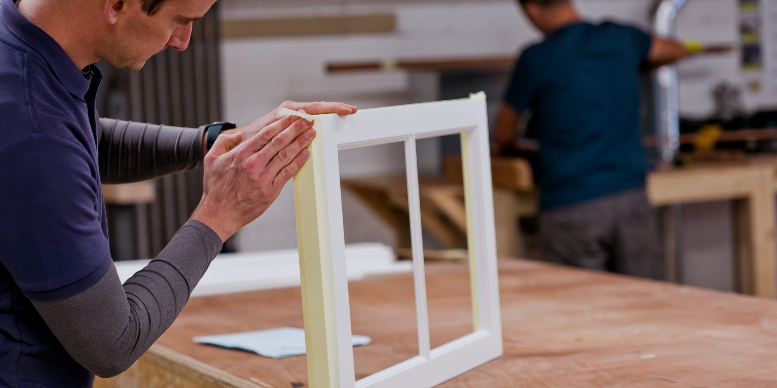 Workman sanding sash window part