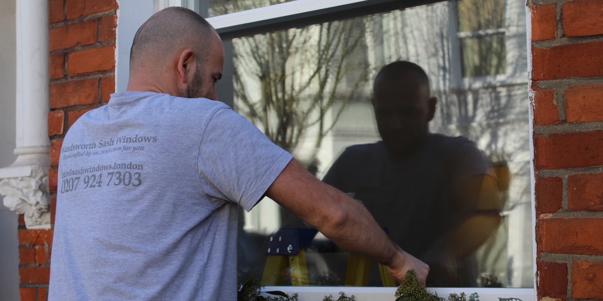 Carpenter installing sash windows Carpenter installing sash windows