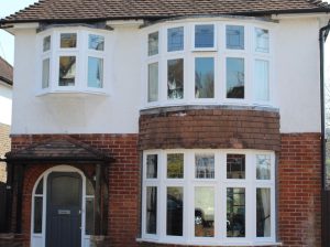 Detached house with casement windows including bay window 