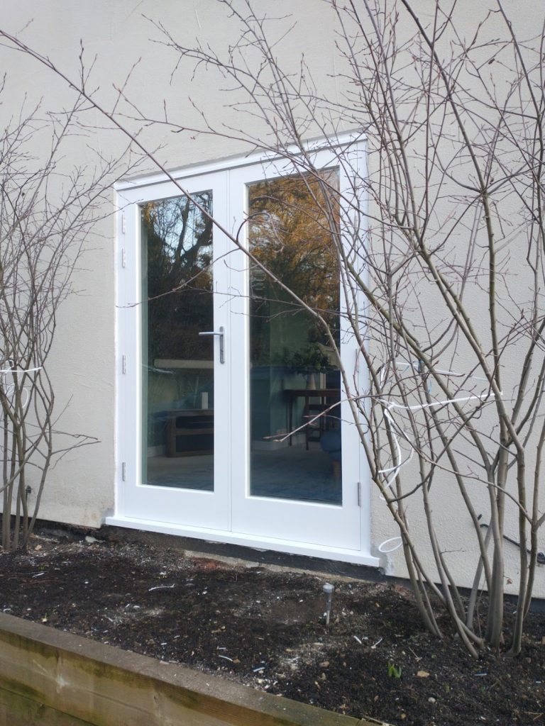 Exterior rear window converted to double doors