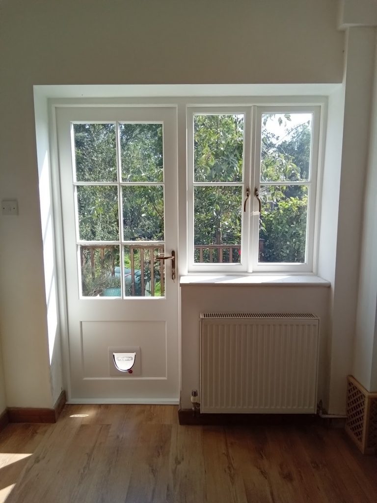 Rear double windows converted to window and door