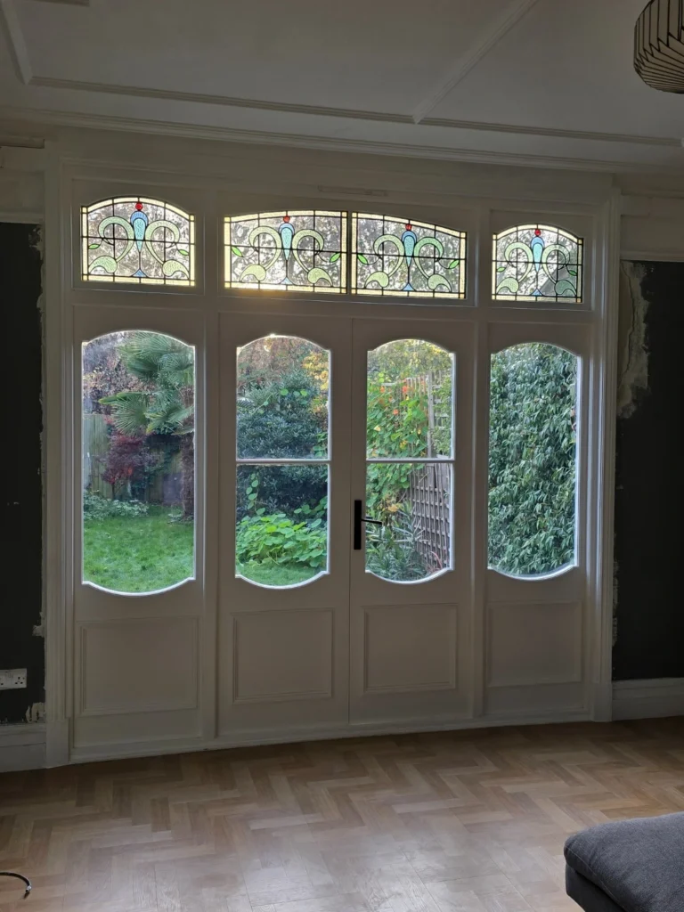 New timber French doors with stained glass installed in Brixton