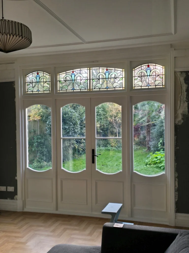 Internal view of new French doors with stained glass in London