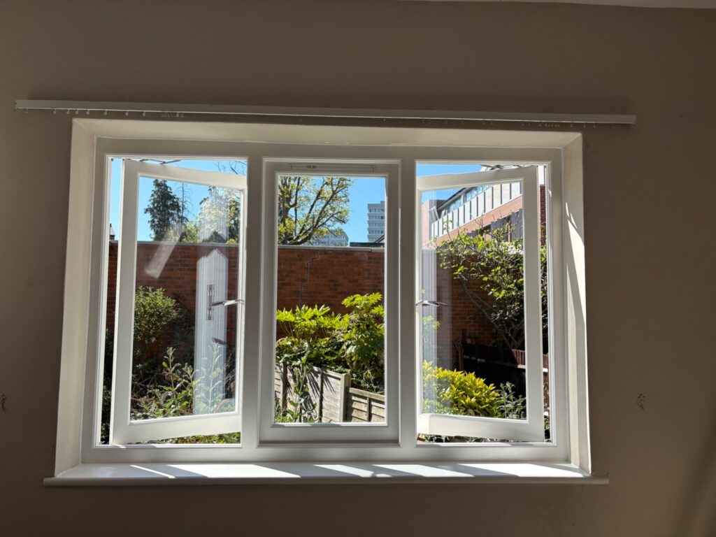 Timber casement window hung on friction hinges