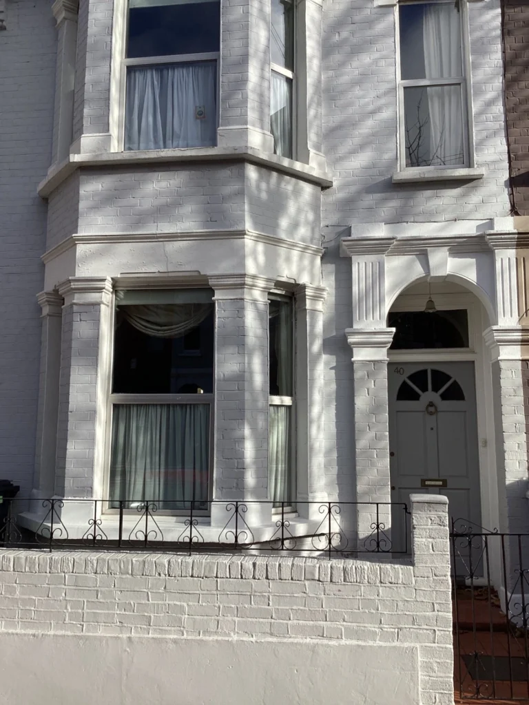 External view of Victorian property with non-original windows