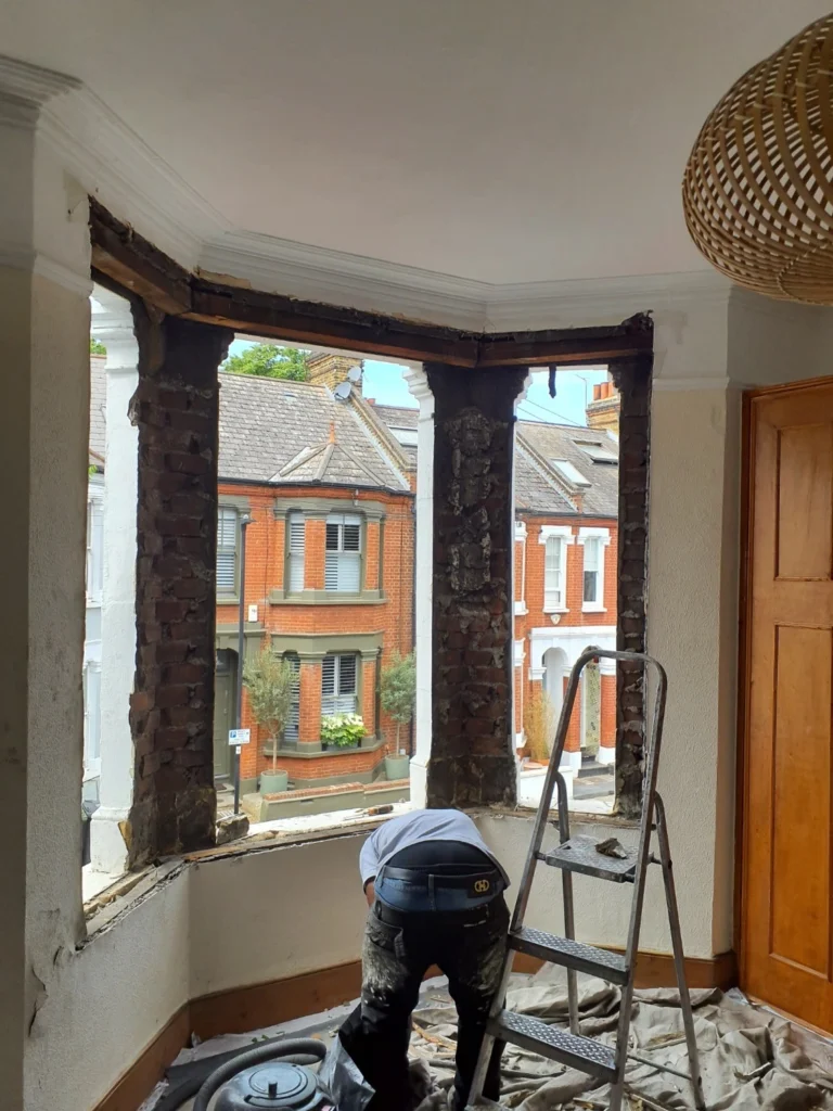 Timber sash windows being removed and refitted