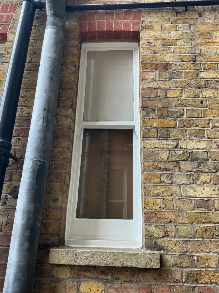 Original timber box sash window in a Prince of Wales Drive mansion block, Battersea