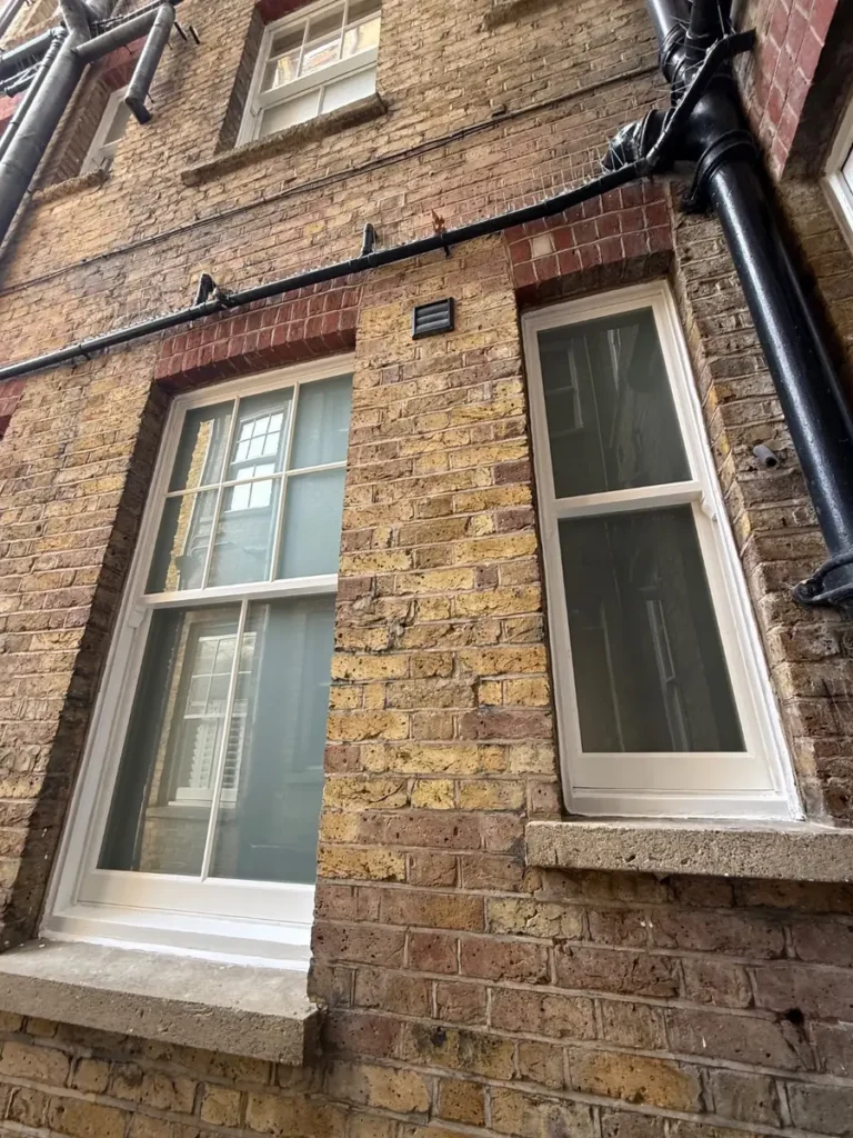 New timber sash windows on the rear elevation of a Battersea mansion block